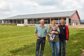 Manfred Schifferings with his daughter Heike and family at the new dairy cubicle barns. (Sustainable project: Schifferings farm)